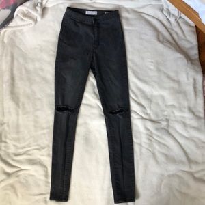 High-waisted black skinny jeans